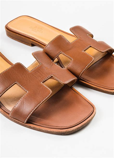 Hermès Oran Leather Slides .